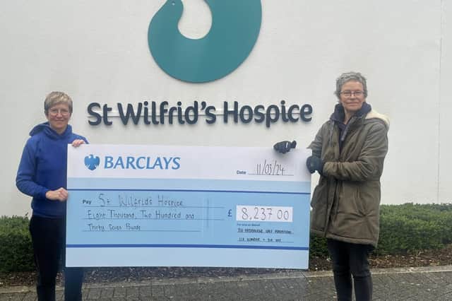 Eastbourne Half Marathon organisers Liz Lumber and Sue Fry present cheque to St Wilfrid’s Hospice