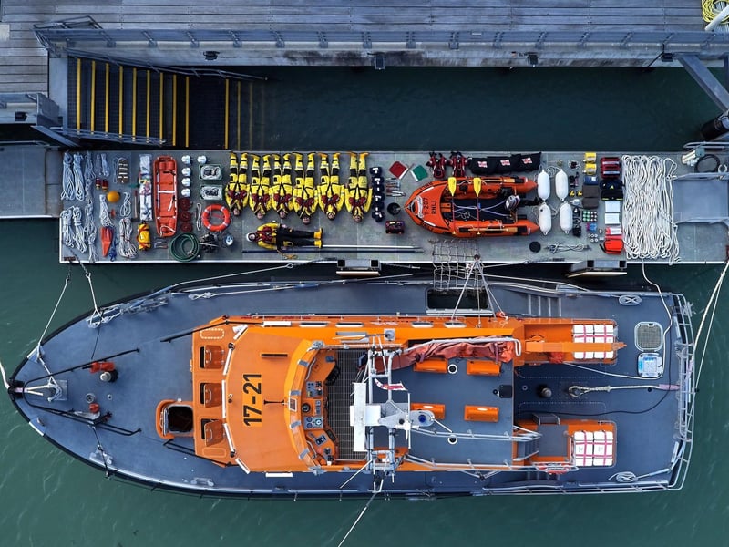 The ‘David and Elizabeth Acland’ with kit and crew unpacked. The 17-21 Severn class All-weather Lifeboat is on service in Newhaven today. The largest lifeboat in the RNLI fleet, the Severn class was developed in the early 1990s and introduced into the fleet in 1996. In 1999, the ‘David and Elizabeth Acland’ arrived in Newhaven. Upside-down crew, left to right: Danny Woodford, John Simcock, Michael Stringer, James Johnson, Peter Everard (Trainor/Assessor), Lewis Arnold (Coxswain), and sideways: Andy MacQueen.