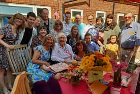 Joan Wilson celebrating her 100th birthday with family at Clapham Lodge Care Home, near Worthing