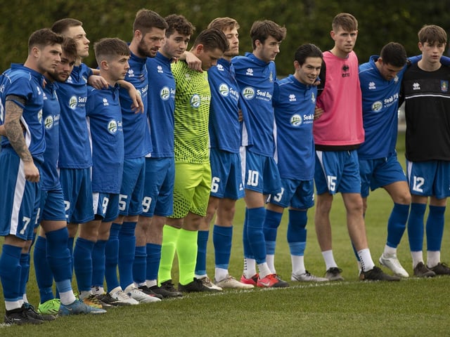 Selsey and Worthing Players have a minute's silence before their match for Club member Bob Pearce