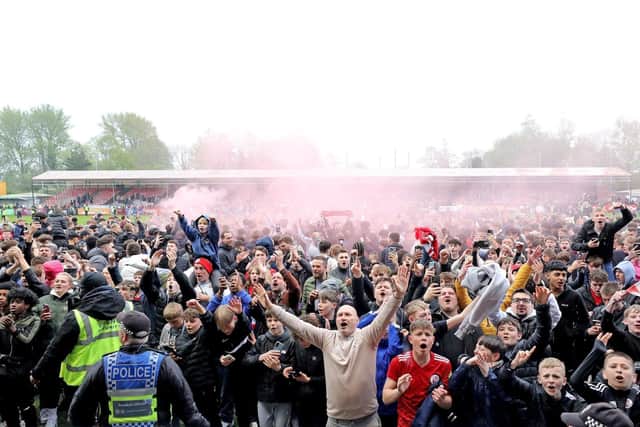 The fans invade the pitch after the Grimsby game where Reds secured a play-off place | Picture: Chris Dyson Photography