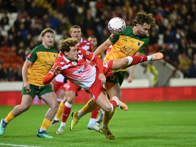 Callum Styles of Barnsley high foot during the Emirates FA Cup First Round match between Barnsley and Horsham at Oakwell Stadium.