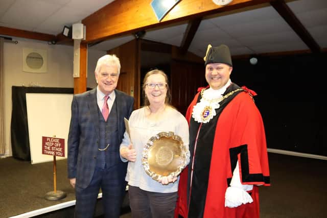 Hastings Bonfire Society chairman Heather Leech receives the trophy from the Mayor and Hastings Week chair Reg Wood. Pic by Kevin Boorman
