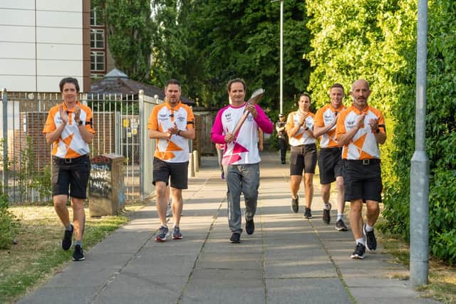 James Dawson carrying the baton as part of the Birmingham 2022 Queen's Baton Relay across the Commonwealth. Picture: Matt Clark photography