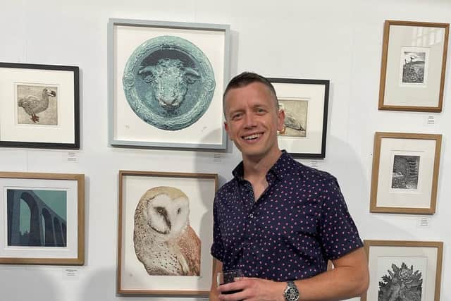 Worthing printmaker Wayne Longhurst with his winning Bull of Iffley and his Barn Owl. Picture: Claire Longhurst / Submitted