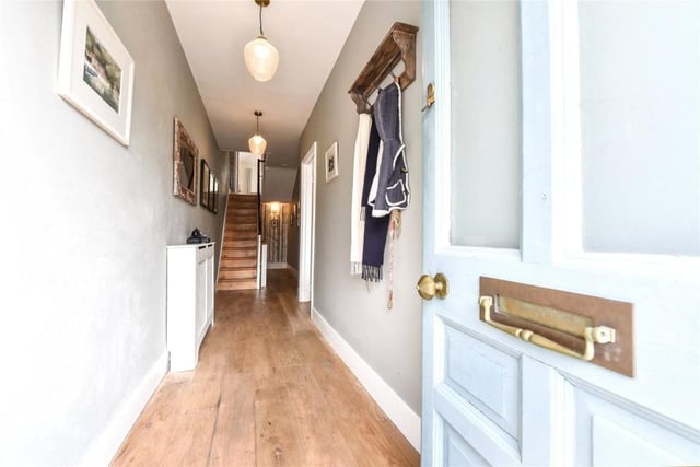 The front door opens into a gorgeous, welcoming hallway.