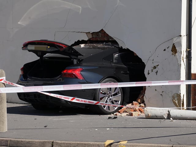Three people injured after car crashes into wall of house in Eastbourne - in pictures