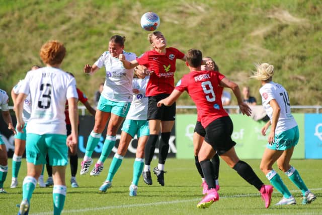Lewes and Southampton battle for the ball | Picture: James Boyes