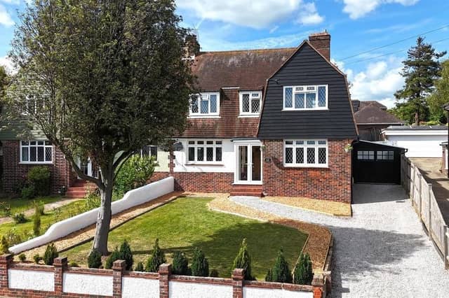 This distinctive Dutch barn style family home boasts spacious and versatile accommodation in a highly-sought-after position