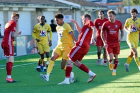 Hassocks in recent action againt Lancing | Picture by Stephen Goodger