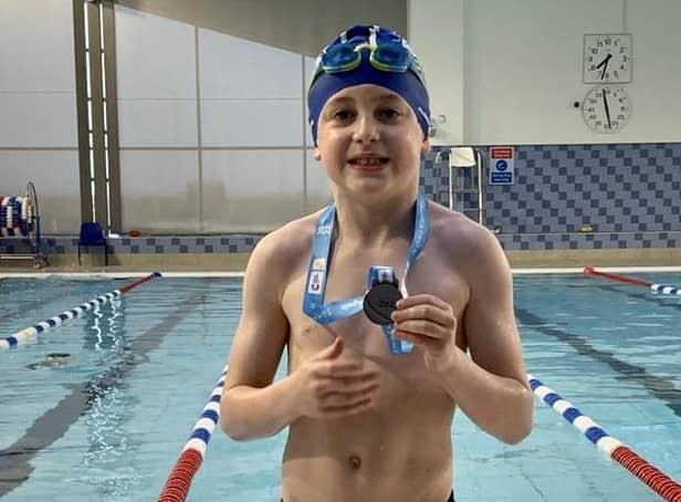 Harry raised over £400 by swimming 100 lengths for Cancer Research UK