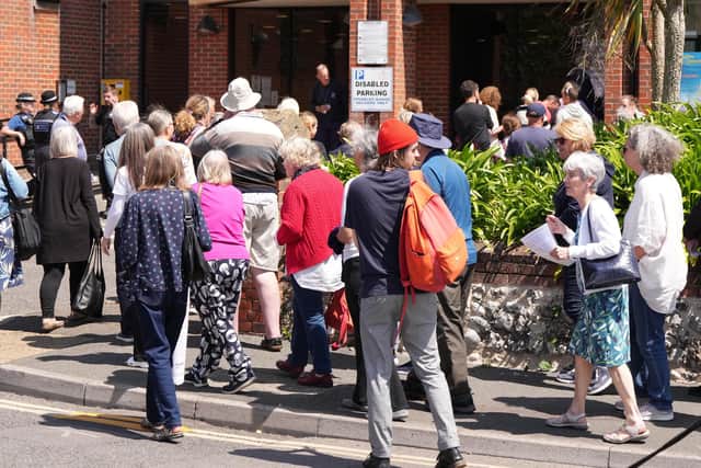 Protestors gathered outside the district council building in Littlehampton, before a committee refused plans for 190 new houses in Angmering. Photo: Eddie Mitchell