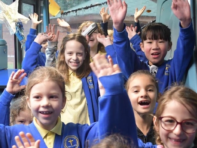 Pupils show their support for the new bus