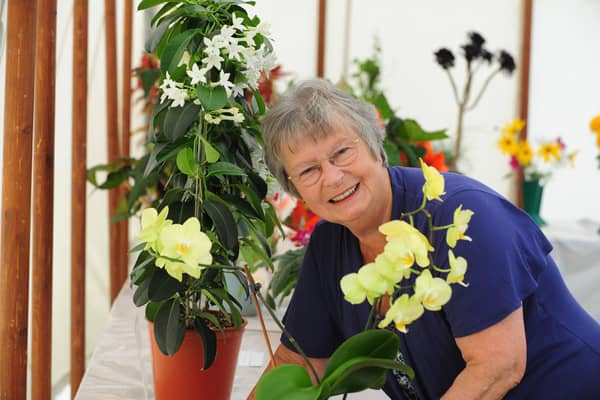 Yapton Cottage Gardeners’ Society vice-president Stella Whitelock, pictured with her orchid at a previous show