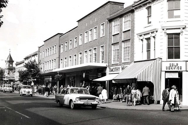 This image from the top end of Terminus Road shows the station in the distance. There was a road called Terminus Place running off by the self-service supermarket. Next door was Timothy Whites, a pharmacy and chemist shop, further along was a Sainsbury’s supermarket plus other retailers. These buildings were eventually demolished to make way for the extension to the Beacon Centre.