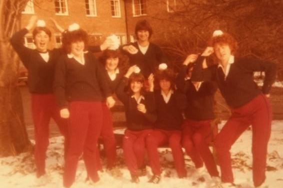 This photo shows us wearing the wonderful cherry red and capri blue of our uniform back then! The older ones among you may remember us wandering around Meads and in town, maybe clutching various sporting paraphernalia. Or playing in the snow. Yeah, I’m front right.