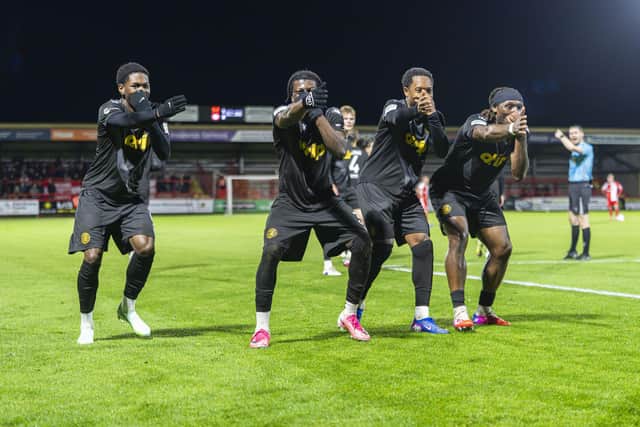 Worthing players celebrate in style at Kidderminster | Picture by Jay Wrighte