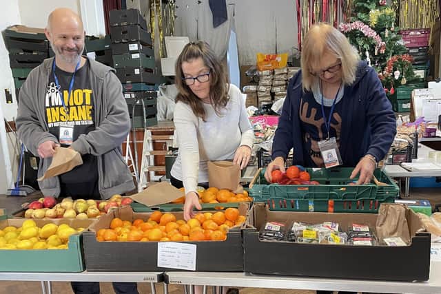 Littlehampton Community Fridge volunteers preparing the produce for customers