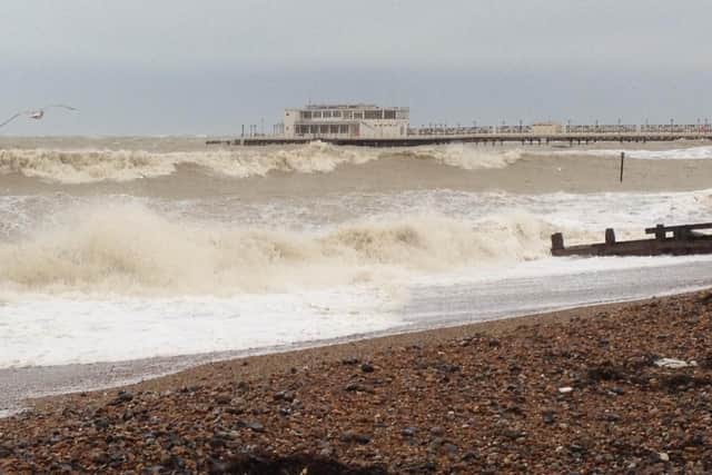 High tide lapping against the underside of Worthing Pier