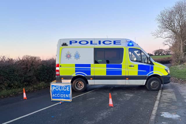 An eye-witness said a road was closed in both directions following the collision