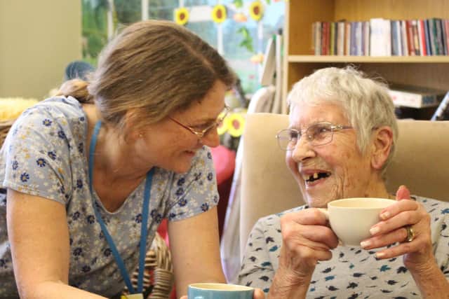 Joy enjoying a chat with carer Carole