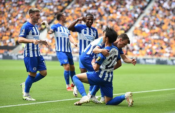 Kaoru Mitoma of Brighton & Hove Albion celebrates with teammates after scoring the team's first goal at Wolves