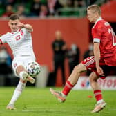 Brighton & Hove Albion midfielder Kacper Kozłowski (L) in action for Poland against Russia in 2021. Picture by Thomas Eisenhuth/Getty Images