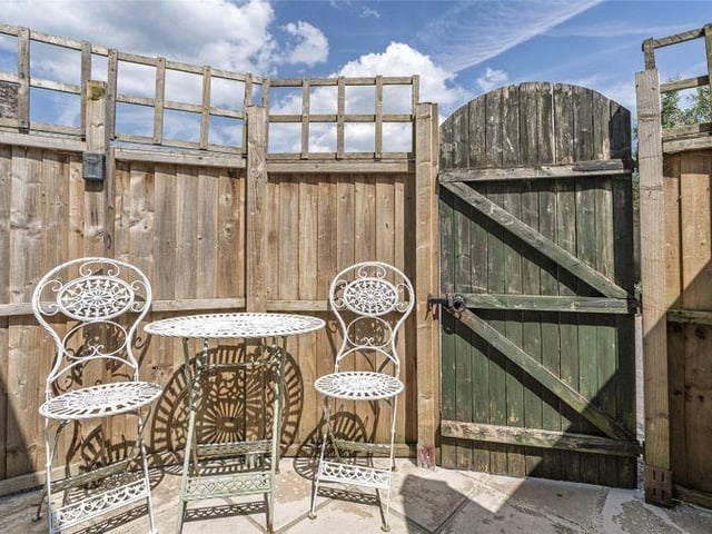 The garden is paved space with room for outdoor dining
