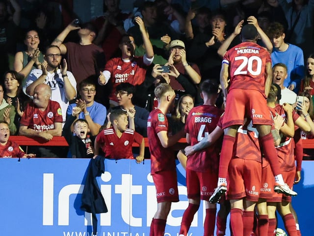 Crawley celebrate a goal against Swindon Town in the Carabao Cup