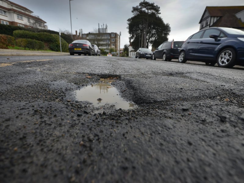 Buckhurst Road potholes and uneven road surface in Bexhill. Pictured: Some of the stones that have been thrown up from the surface as vehicles pass the area.