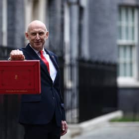 Britain's Chancellor of the Exchequer John Healey poses with the Budget Box as he leaves 11 Downing Street in central London on October 28, 2026, before presenting the government's annual budget to parliament. (Photo by Henry NICHOLLS / AFP via Getty Images)