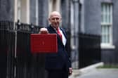 Britain's Chancellor of the Exchequer John Healey poses with the Budget Box as he leaves 11 Downing Street in central London on October 28, 2026, before presenting the government's annual budget to parliament. (Photo by Henry NICHOLLS / AFP via Getty Images)