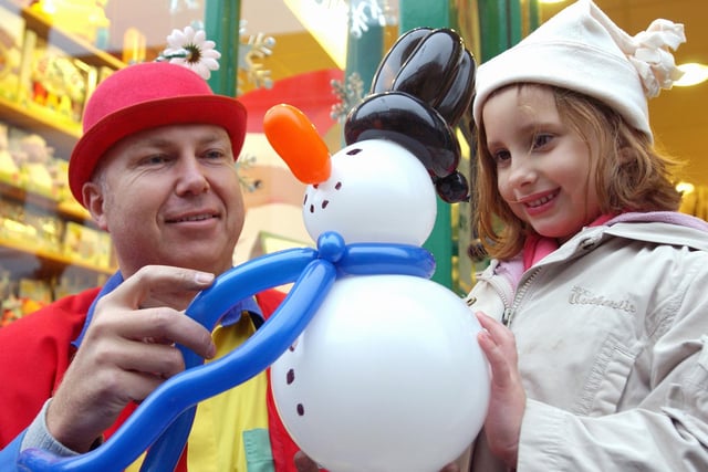 Elena Scrivens, six, with magician Adrian Wright
