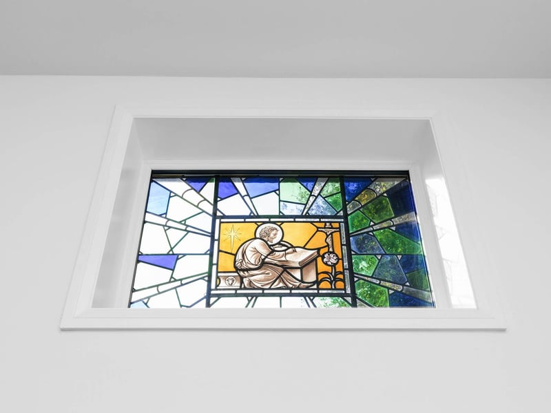 The ground floor has original high level stained glass windows