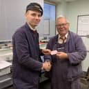 Ben Gray being passed his driver’s card by Bluebell Railway inspector Chris Suitters  at Sheffield Park. Picture: Tim Gray