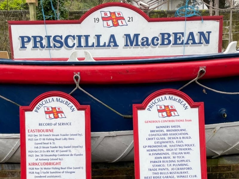 Priscilla MacBean signs