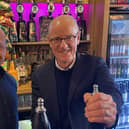 Callum Smith-Warren with Nick Gibb behind the bar at the Punch &Judy.