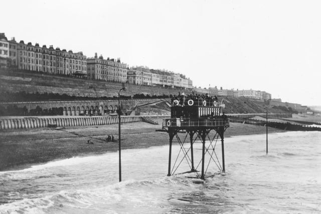An electric railway carrying a carriage on parallel tracks along Brighton beach from the Banjo Groyne to Rottingdean, circa 1895: