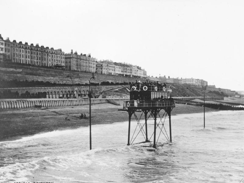 An electric railway carrying a carriage on parallel tracks along Brighton beach from the Banjo Groyne to Rottingdean, circa 1895: