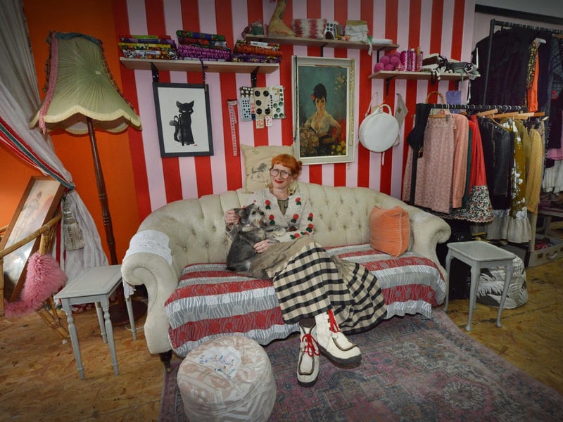 Unzipped Sewing Café at 40a Marina, St Leonards. Owner Vanessa Newman is pictured with her dog, Coco.