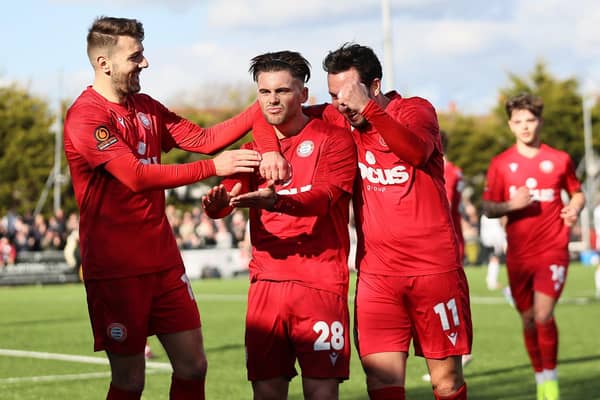 Danny Cashman - scorer of both Worthing's goals in the 2-2 draw with Bath City - is congratulated | Picture: Mike Gunn