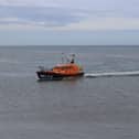Hastings lifeboat towing fishing boat