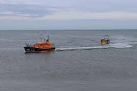 Hastings lifeboat towing fishing boat