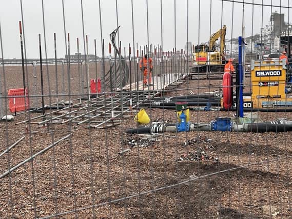 The temporary pumps and scaffolding on the beach