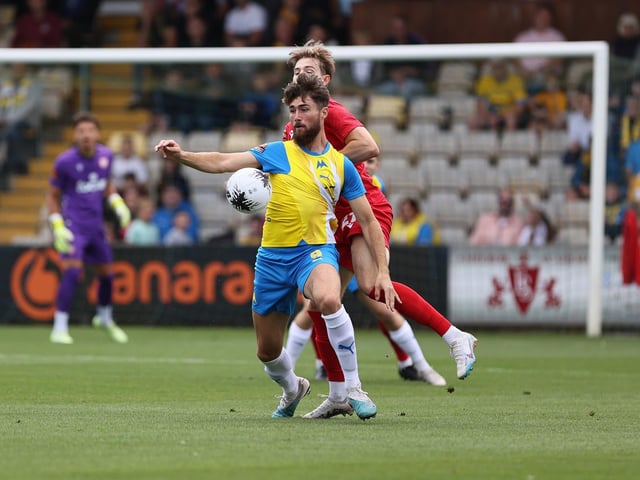 Action from Worthing's 3-0 win at Torquay United which put them top of National League South