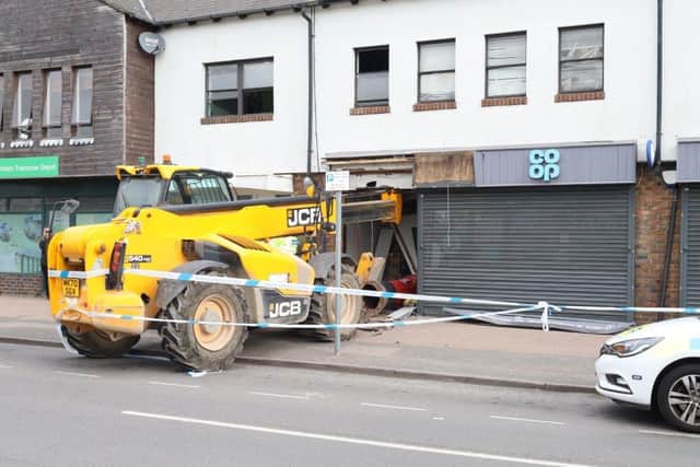 The JCB after smashing into the store