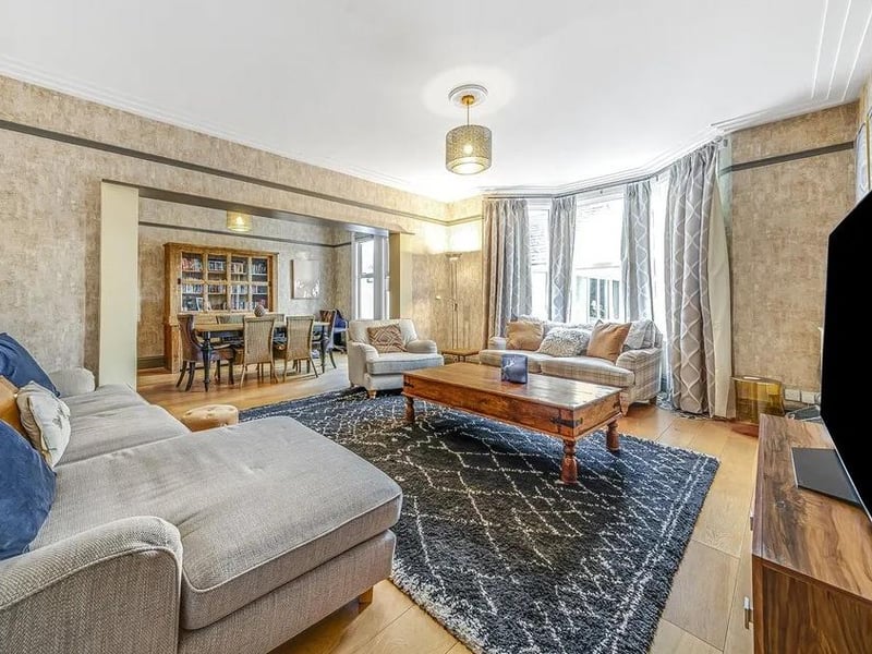 A large reception room combines the living area and dining room into one space