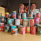 V2 Radio presenters Neale and Tanya with some of the tins already donated