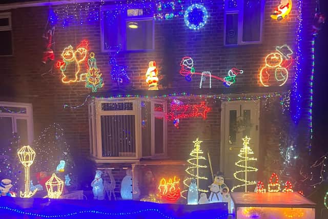A Chichester resident has spoken of his pride at collecting for charity as he has put on a Christmas lights display at his house for 20 years.