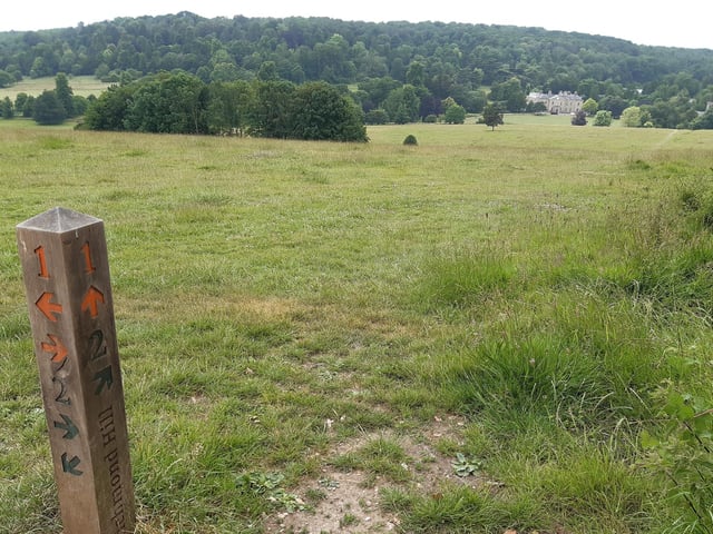 You need to use the pedestrian gates to get on to the grazing land and then you are on Richmond Hill, with Stanmer House and Stanmer Parish Church ahead of you. The path is pretty much a straight diagonal line across the field, heading towards the church.